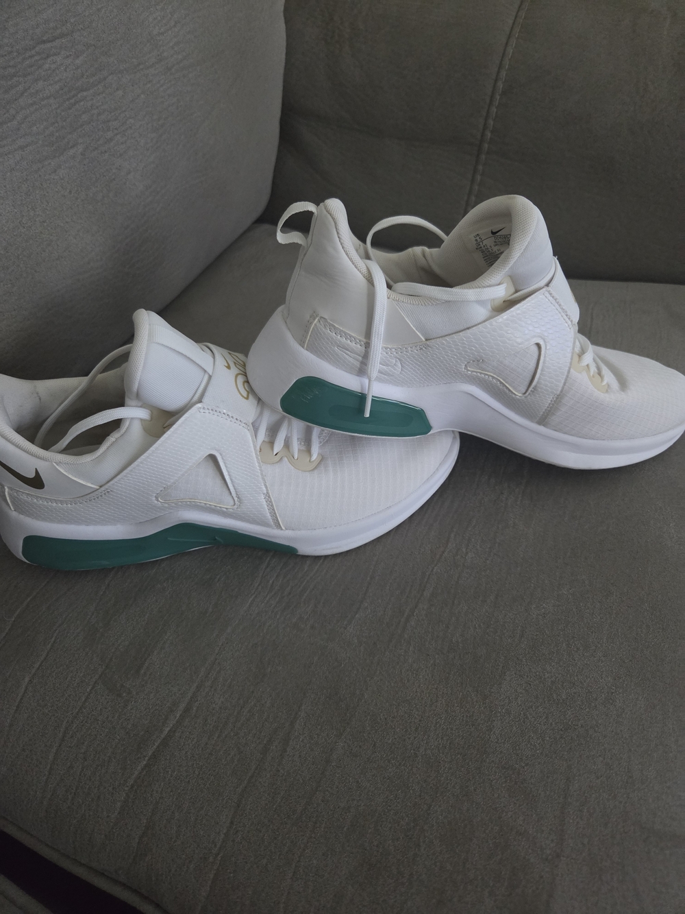 Nike Women's White Sneakers with Teal Midsole Accents